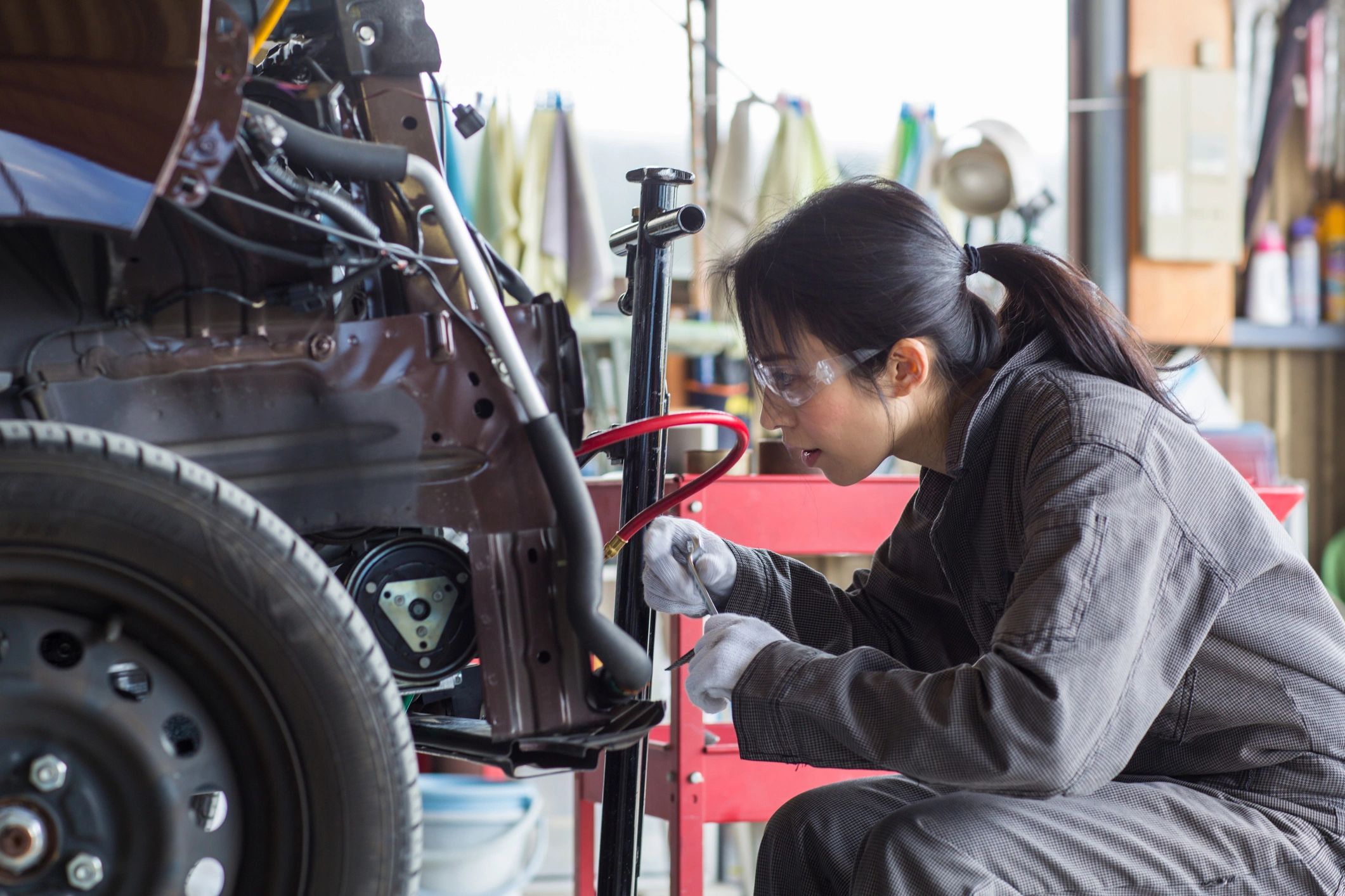 auto mechanic working Japanese car